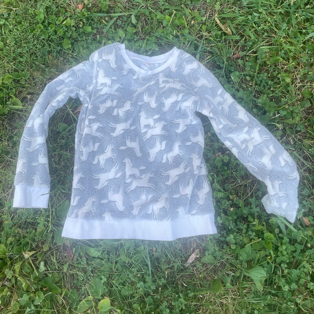 Grey and white animal print sweater.